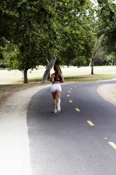 Teen Woman Running On Bike Trail From Back — Stock Photo, Image