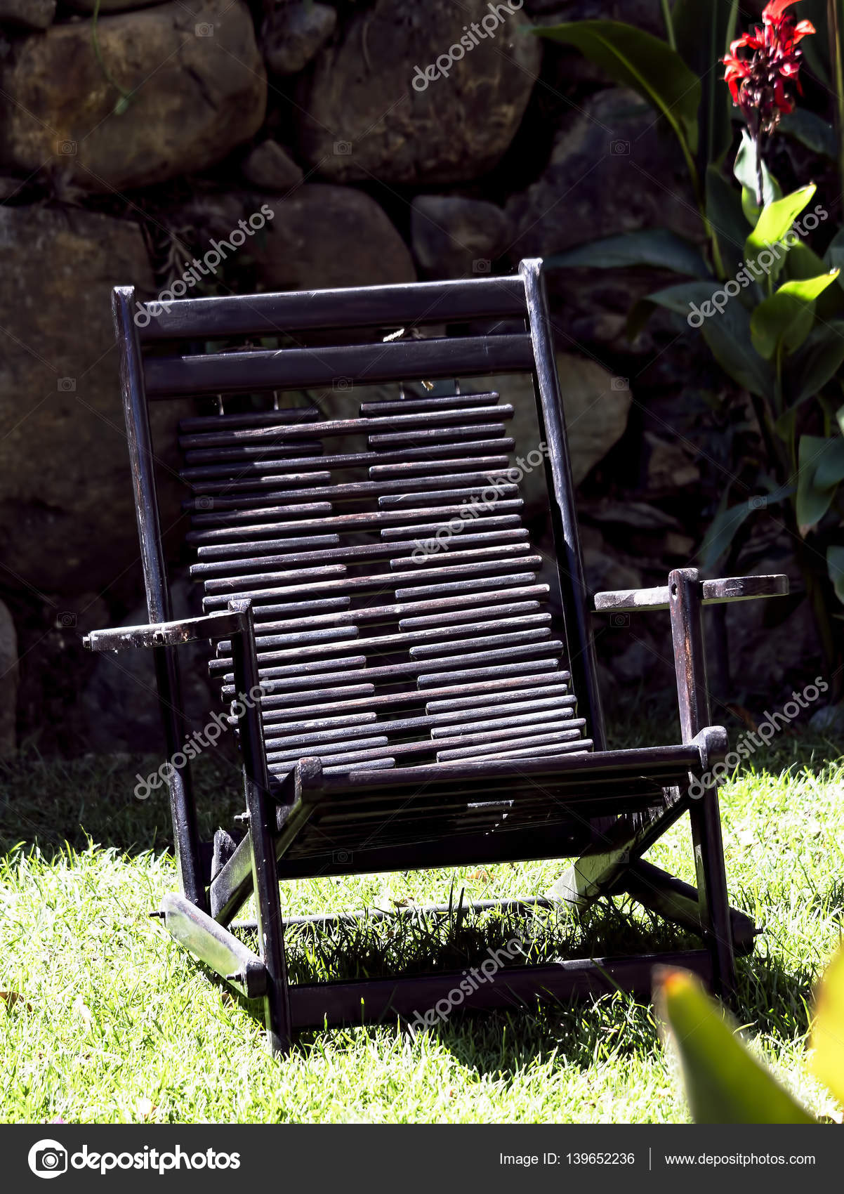 Black Wooden Chair Sitting On Grass Resort Peru Stock