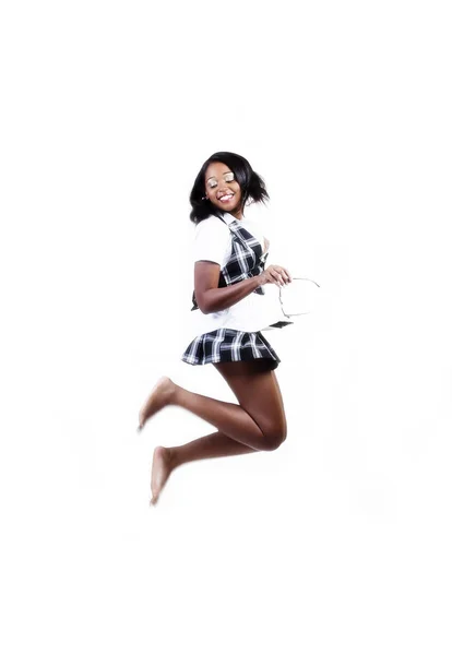 African American Woman In Plaid Skirt And Vest Jumping — Stock Photo, Image