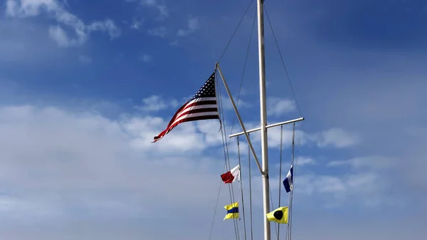 United States Flag And Naval Signal Flags Flying On Nautical Fla — Stock Photo, Image