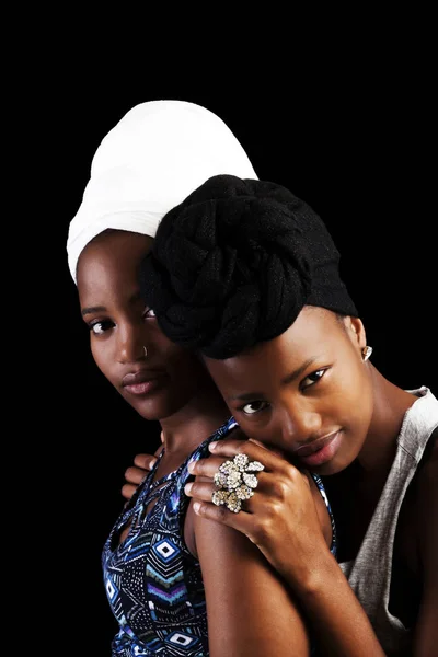 Two African American Sisters In Headscarfs On Dark Background — Stock Photo, Image