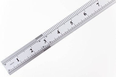 Metric, imprial steel ruler, isolated on white.