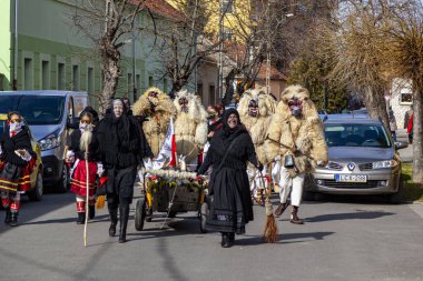 Hungary Mohacs Feb 23, 2020: Participants at the Buso walking festival-ending the day before Ash Wednesday. People wearing traditional masks include folk music, masquerading, parades and dancing.