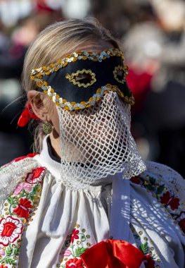 Hungary Mohacs Feb 23, 2020: Participants at the Buso walking festival-ending the day before Ash Wednesday. People wearing traditional masks include folk music, masquerading, parades and dancing.