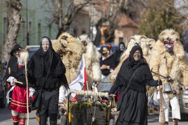 Hungary Mohacs Feb 23, 2020: Participants at the Buso walking festival-ending the day before Ash Wednesday. People wearing traditional masks include folk music, masquerading, parades and dancing.