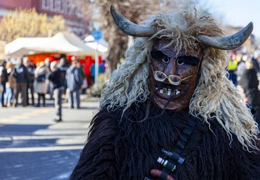 Hungary Mohacs Feb 23, 2020: Participants at the Buso walking festival-ending the day before Ash Wednesday. People wearing traditional masks include folk music, masquerading, parades and dancing.