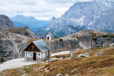 Mountain chapel near Tre Cime di Lavaredo in Dolomites clipart