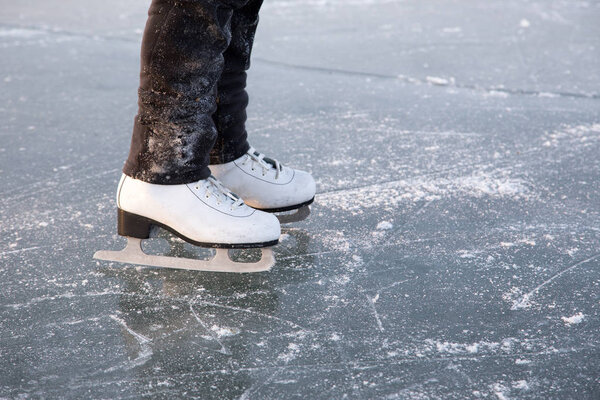 Young woman ice skating outdoors