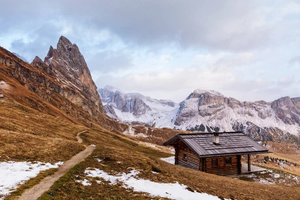 Idyllic alpine mountain scenery with traditional old mountain wooden cottage in Seceda peak, Dolomiti. South Tyrol, Italy