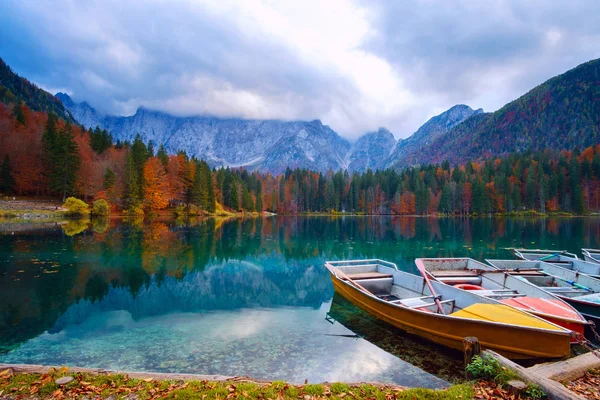 Alpine lake and colorful boats, Lake Fusine, Italy — стоковое фото