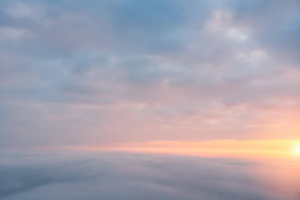 Drone fly above a cloudy sky