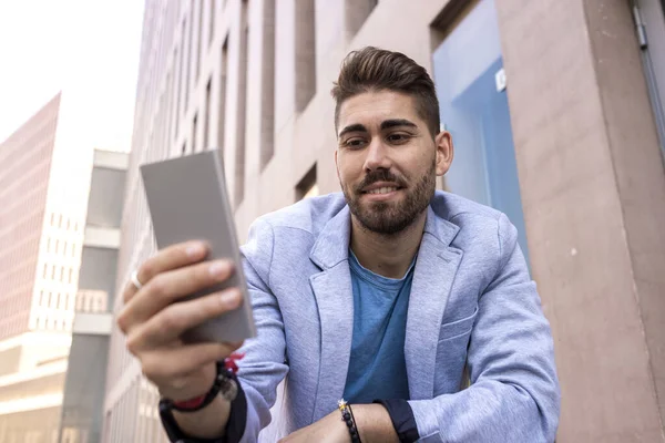 Portrait Handsome Young Man Smiling Using His Mobile Phone — Stock Photo, Image