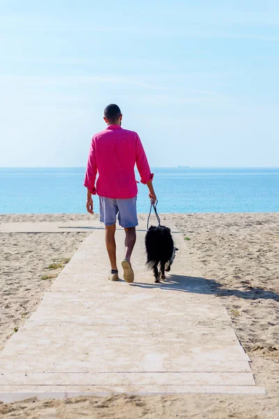 Young Man Walking His Dog Tied Beach — Stock Photo, Image