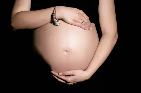 Horizontal View Pregnant Belly Dark Background Stock Photo