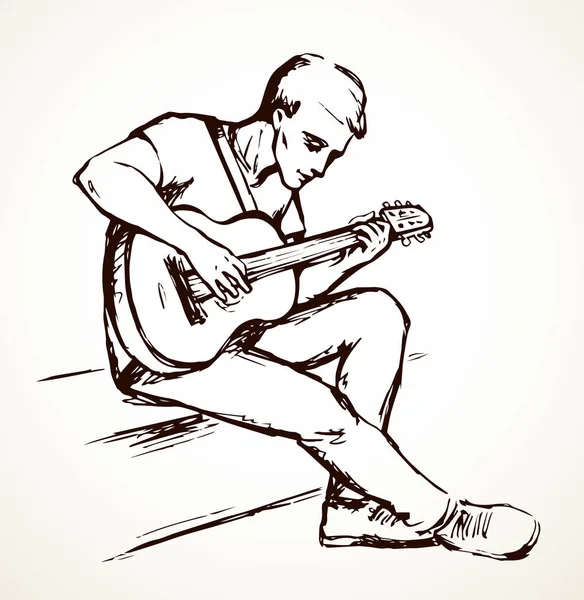 Człowiek gra na gitarze. Rysowanie wektorowe — Wektor stockowy