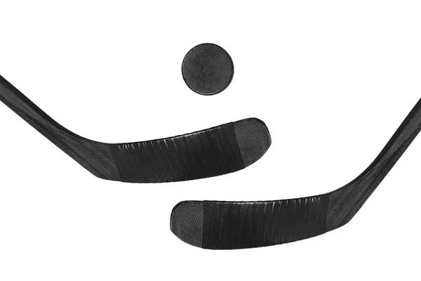 Hockeypuck en twee stokken — Stockfoto