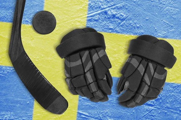 Swedish flag, hockey puck, stick and gloves — Stock Photo, Image