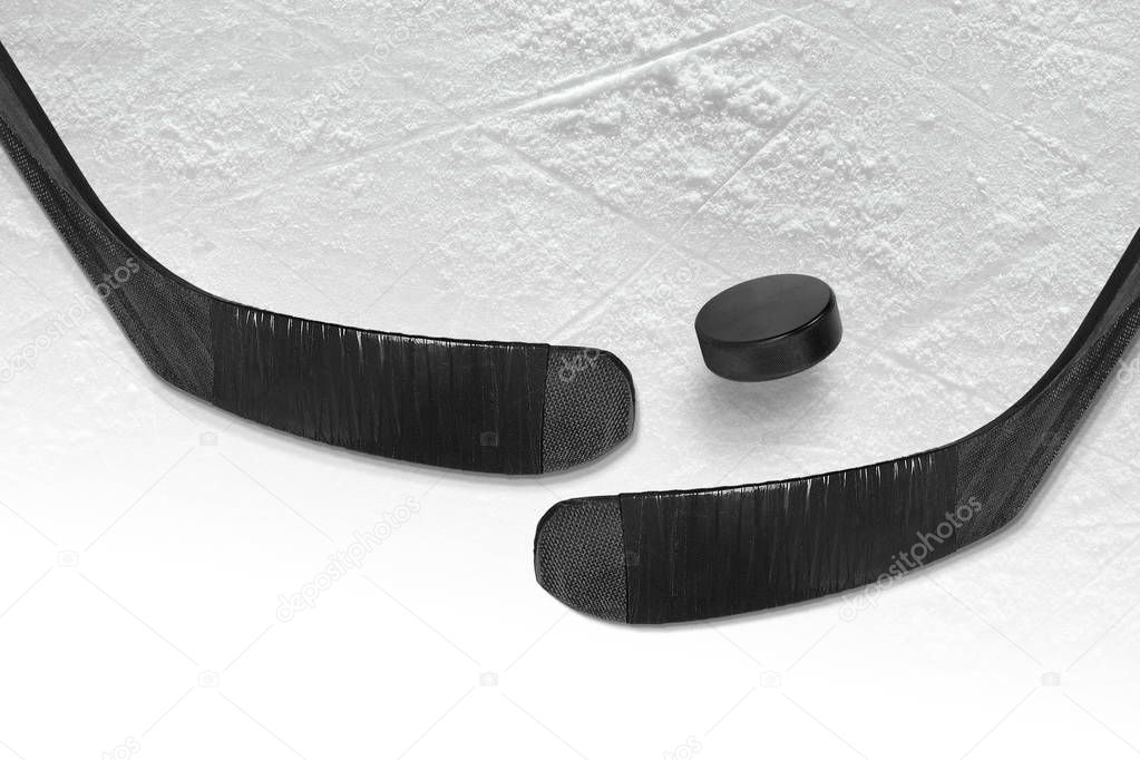 Hockey puck and stick two black ice