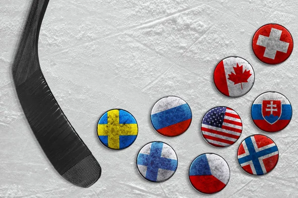 Hockey pucks and putter on ice — Stock Photo, Image