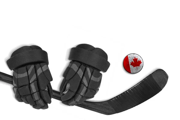 Puck canadiense, guantes y palo de hockey —  Fotos de Stock