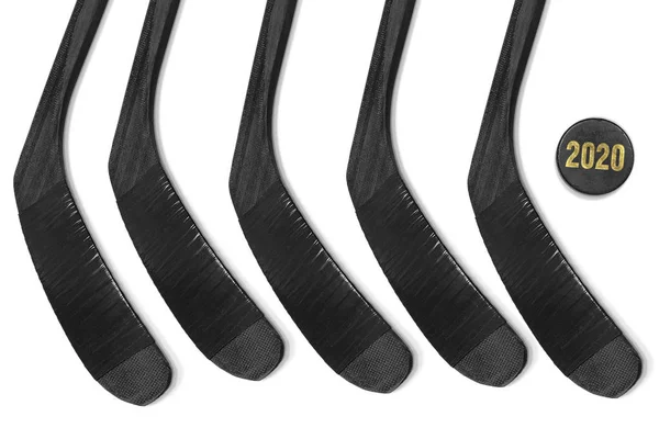 Five hockey sticks and puck on a white background — ストック写真