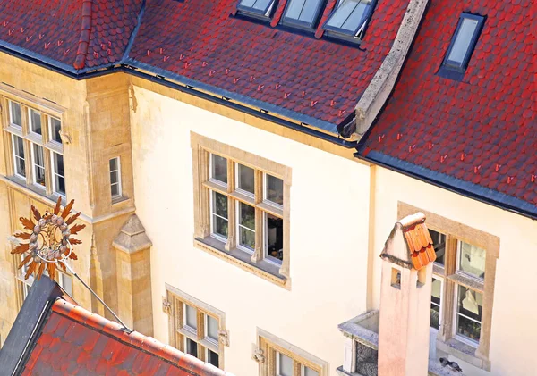 Beautiful view of old vintage building with red roof in old town from old town hall of Bratislava, Slovakia. Vintage sign on roof of old town hall left — Stock Photo, Image