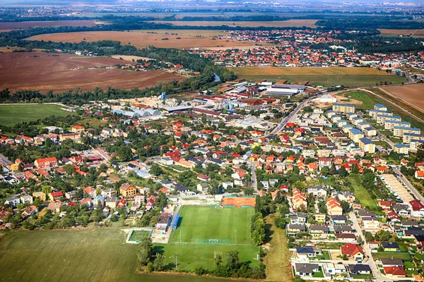 Top view of a village, agricultural field and soccer field near Bratislava, Slovakia. Drone view