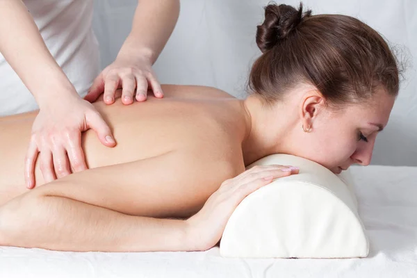 Massage of the woman indoors, body rejuvenation — Stock Photo, Image
