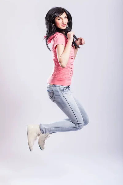 Attractive young girl jumping — Stock Photo, Image