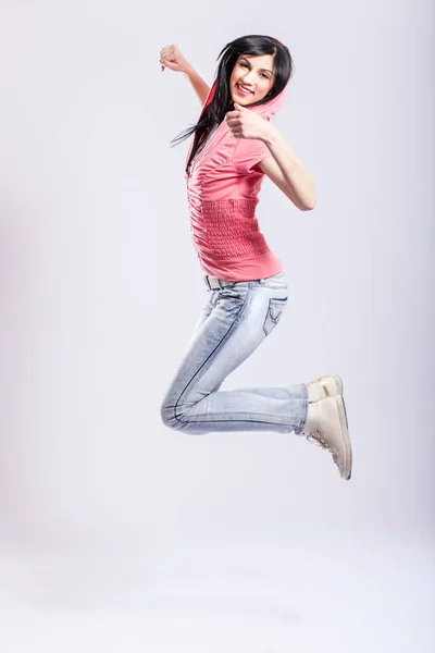 Attractive young girl jumping — Stock Photo, Image