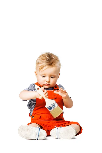 Baby boy with paint brush — Stock Photo, Image