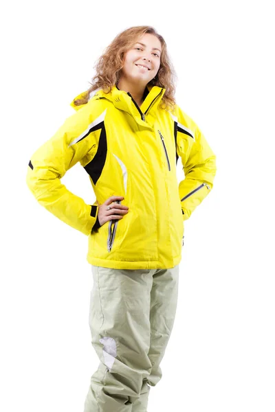 Ski perempuan dalam jaket kuning — Stok Foto