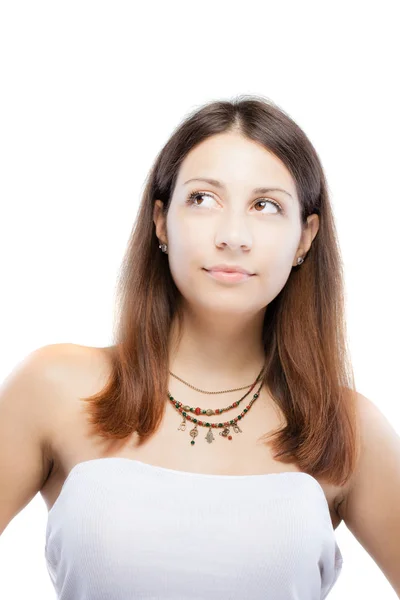 Förvånad brunett tjej bär ett halsband med generiska symboler — Stockfoto