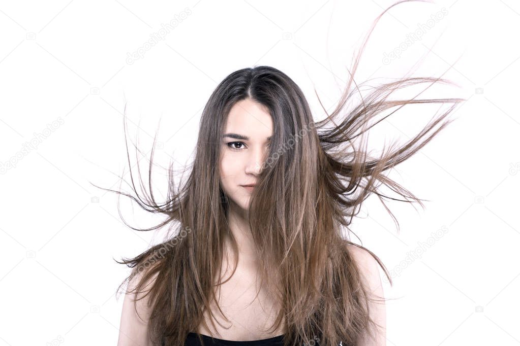beautiful brunette girl with windy hair