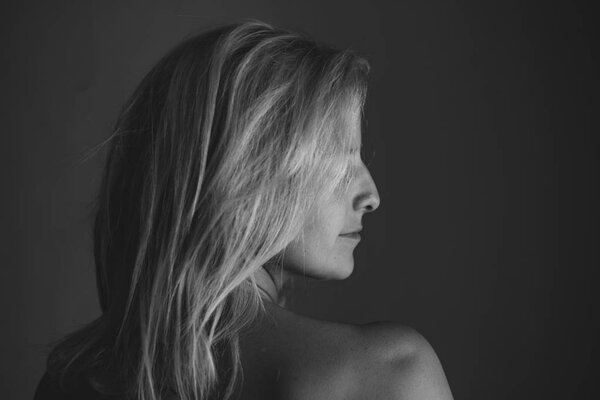 Profile portrait of beautiful long hair woman