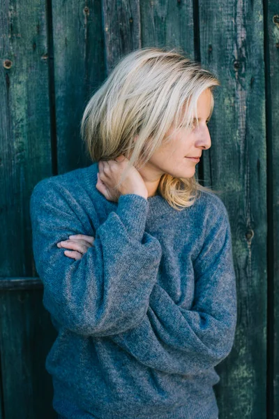Blonde woman in warm sweater — Stock Photo, Image