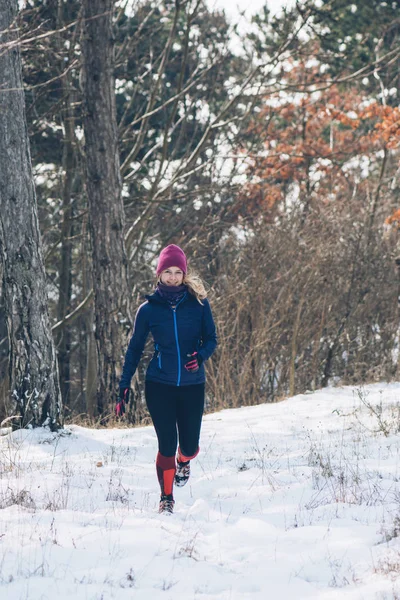 Running woman outdoor. Winter sport concept.
