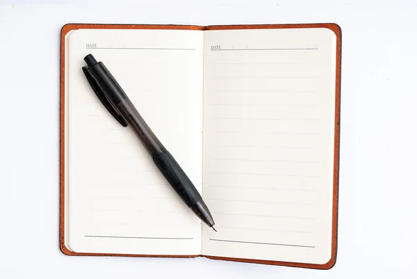 Bloco de notas com caneta isolada — Fotografia de Stock