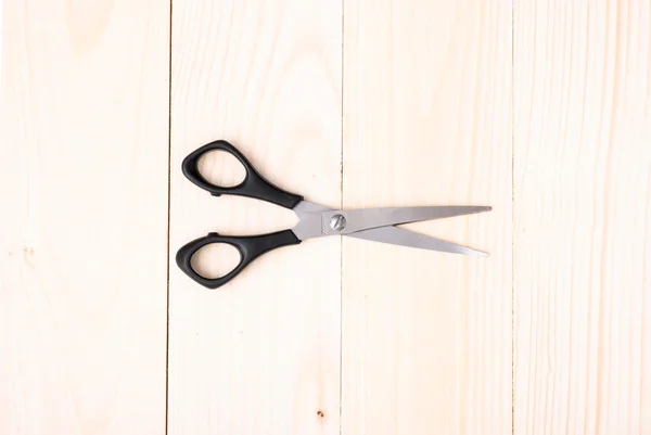 Scissors on wooden background — Stock Photo, Image