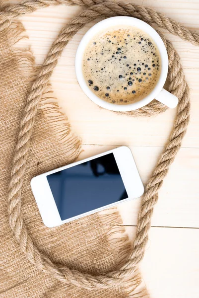 Cup of coffee with foam on wooden table — Stock Photo, Image