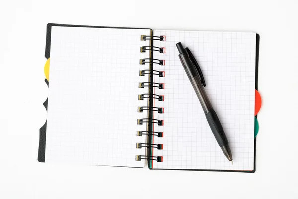 Notizblock mit Stift isoliert — Stockfoto