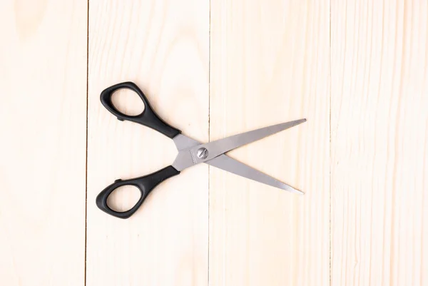 Scissors on wooden background — Stock Photo, Image