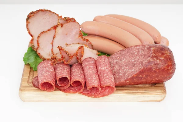 Assorted meat products including ham and sausages. — Stock Photo, Image