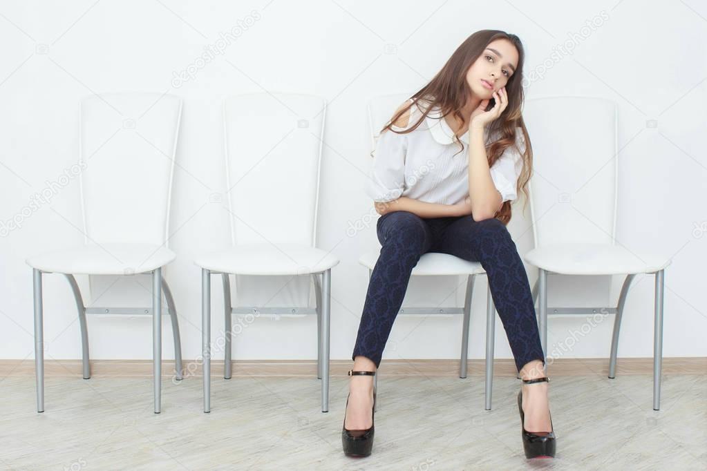 woman feeling sleepy in office loft interior room woman outstretch arm and raising hand cover her mouth for gape people tired or bored time rest and relaxing