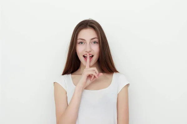 Cute young brunette asking to keep a secret — Stock Photo, Image