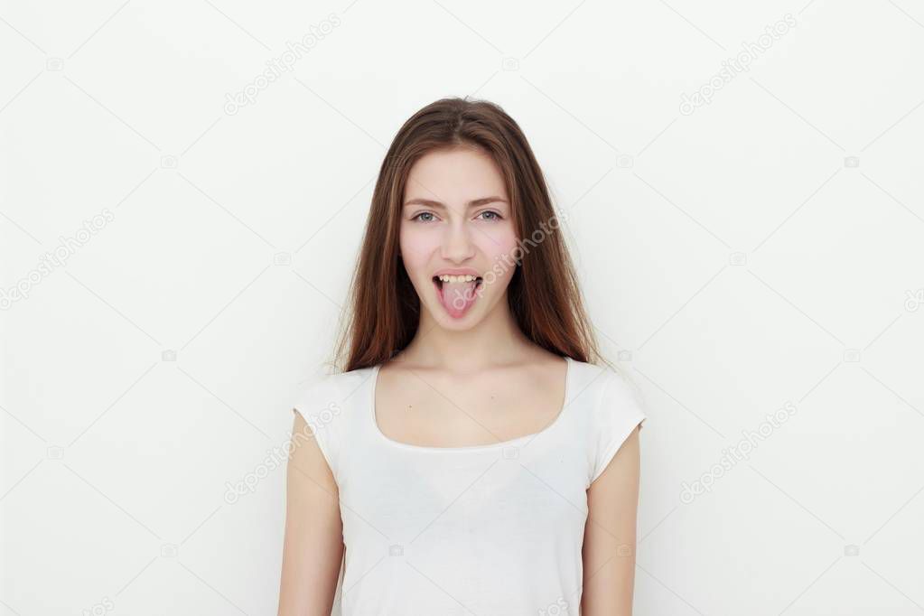 Pretty funny young girl showing tongue