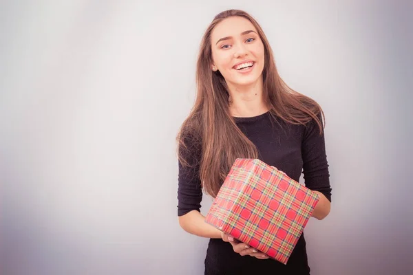 Smiling woman hold red gift box — Stock Photo, Image