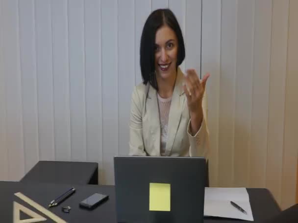 Serious female executive working at her desk with laptop — Stock Video