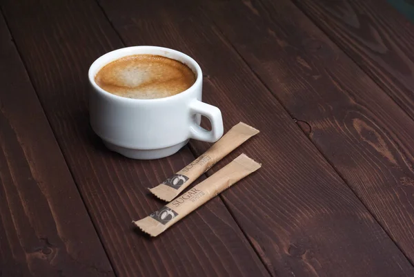 Cup of coffee on wooden background — Stock Photo, Image