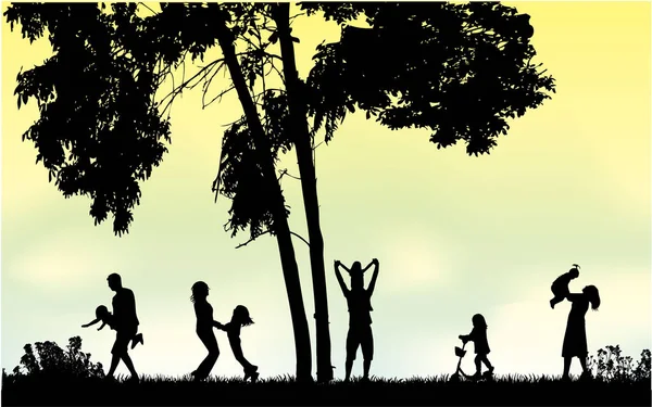 Familiensilhouetten in der Natur. — Stockvektor